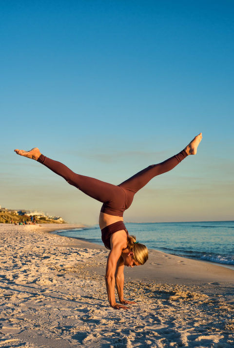 woman on beach in yoga attire doing split hand stand, beach, yoga photography, yoga photographer, atlanta yoga photographer, atlanta photographer,